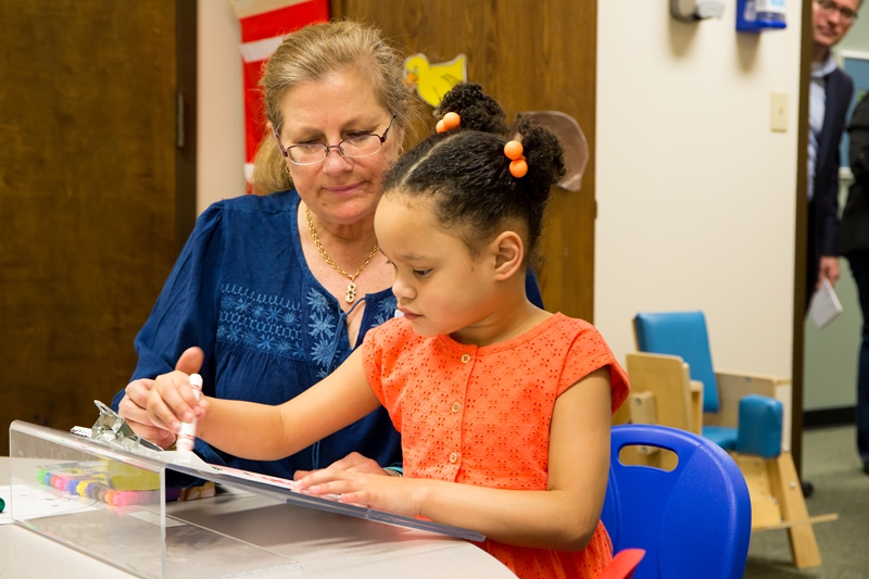 Tina Collop, an occupational therapist with Pediatric Therapy Pineville, part of Carolinas Rehabilitation, works with Ivanka on fine motor skills for functional hand use/grasp, visual motor integration and attention to task.