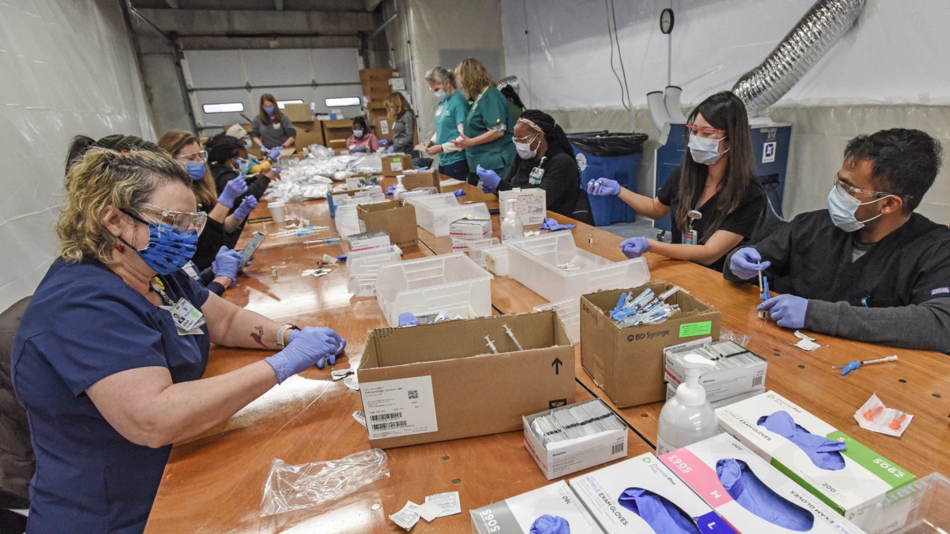 Providing COVID-19 vaccines to thousands of community members within a few days is a massive undertaking. What steps are involved in transporting and preparing COVID-19 vaccines for mass vaccination events? How are safety and training involved?